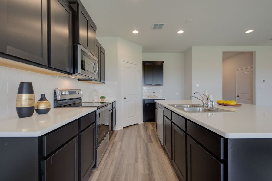 Representative furnished interior of a home built from the Makenzie by Ashton Woods in Hennersby Hollow, San Antonio (Image 12).