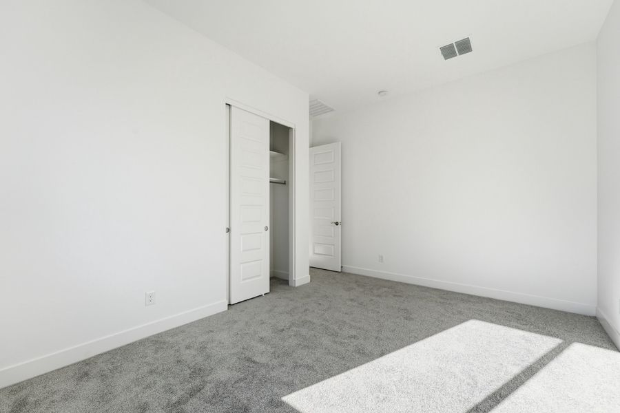 Spacious, unfurnished interior of a new home in Combs Ranch, San Tan Valley (Image 30).