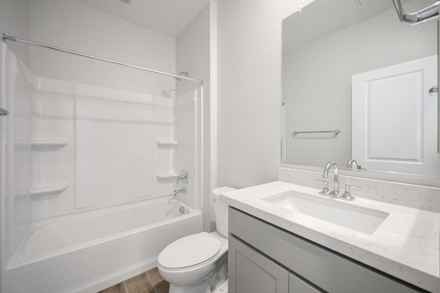 A bathroom with a glass shower.
