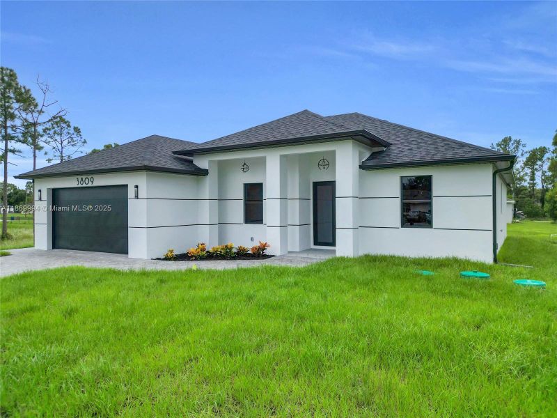 Front exterior of a new home in , Lehigh Acres, FL, highlighting curb appeal (Image 14).