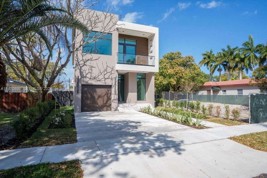 Front exterior of a new home in , Hollywood, FL, highlighting curb appeal (Image 18). Front exterior of a new home in , Hollywood, FL, highlighting curb appeal (Image 18).
