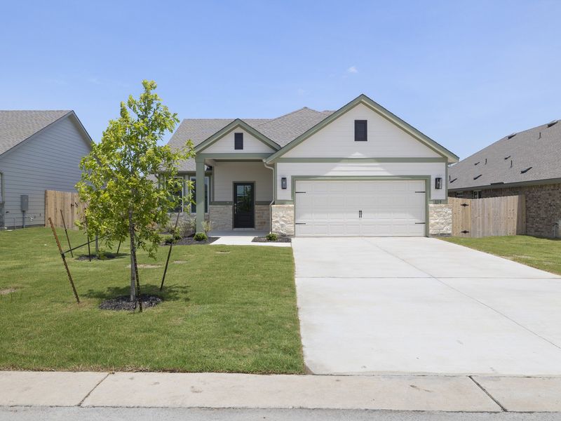 Front exterior of a new home in Grande Estates, Bertram, TX, highlighting curb appeal (Image 1). Front exterior of a new home in Grande Estates, Bertram, TX, highlighting curb appeal (Image 1).