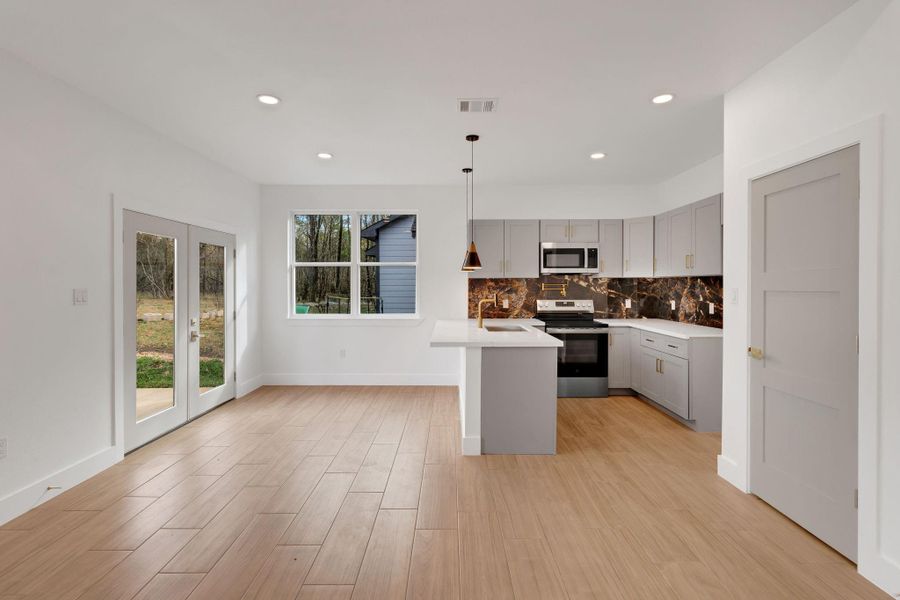 The doors from the dining area lead out to the covered back patio