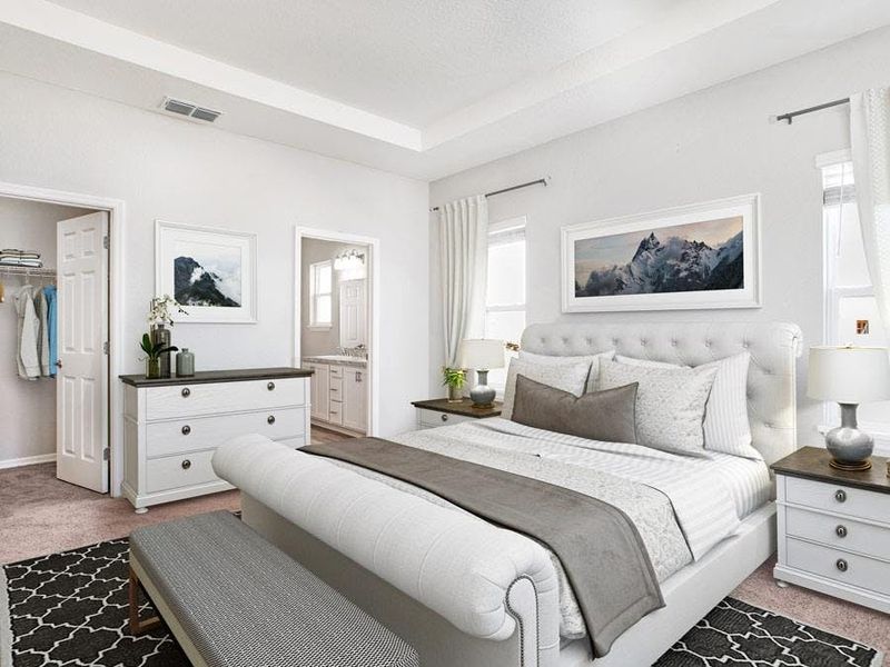 Your spacious owner`s suite includes a tray ceiling, walk-in wardrobe, and lanai access - Savannah by Highland Homes