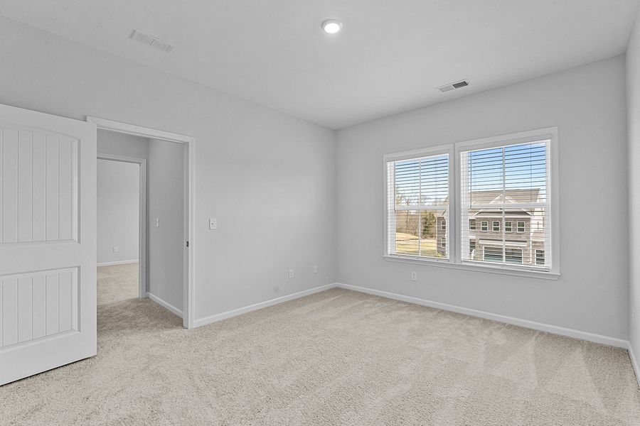 Spacious, unfurnished interior of a new home in Lilah Grove, Summerfield (Image 46).
