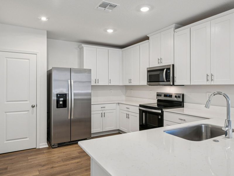 Furnished interior view inside a new home in Ridgehaven - Villas, Ormond Beach (Image 8).