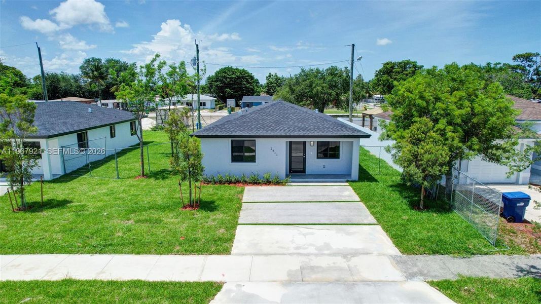 Front exterior of a new home in , Miami Gardens, FL, highlighting curb appeal (Image 29).