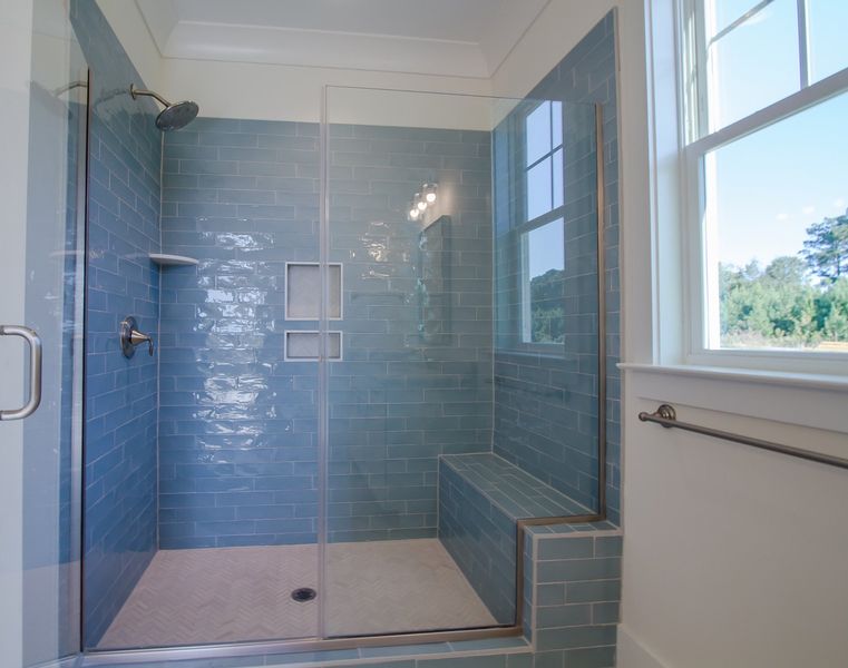 Representative furnished interior of a home built from the The Amherst by RobuckHomes in Windwater, Hampstead (Image 20).