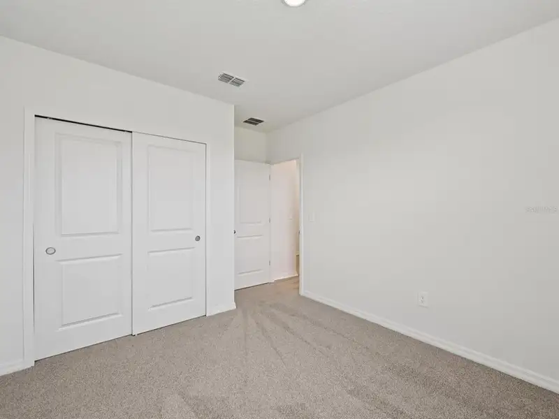 Spacious, unfurnished interior of a new home in The Reserve at Van Oaks, Auburndale (Image 6).