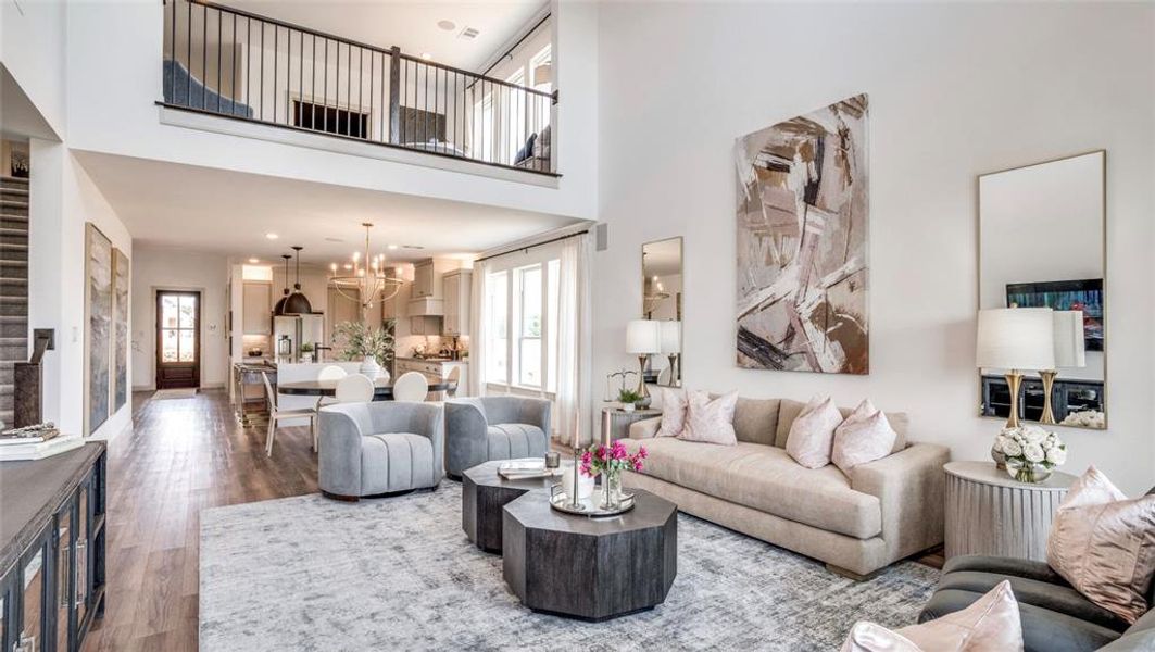 Featuring a spacious room with volume ceilings and dual story windows over looking the backyard, this home is flooded with natural light.