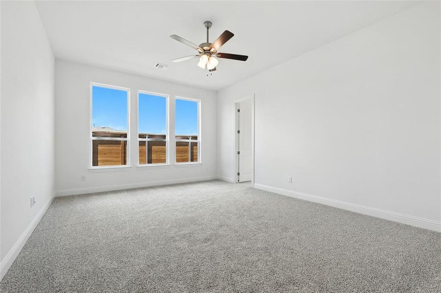 Unfurnished room with carpet floors and ceiling fan