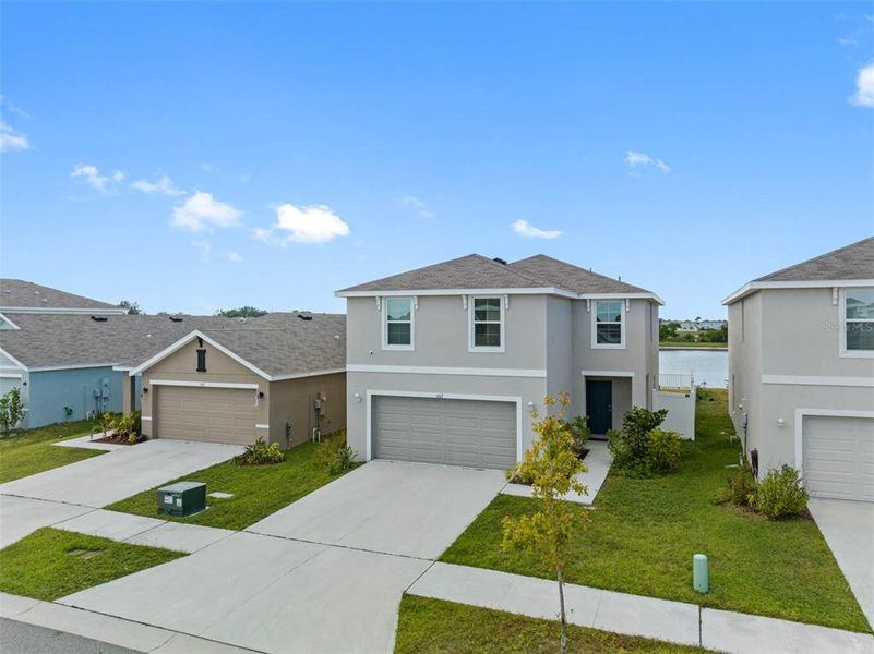 Front exterior of a new home in , Ruskin, FL, highlighting curb appeal (Image 1). Front exterior of a new home in , Ruskin, FL, highlighting curb appeal (Image 1).