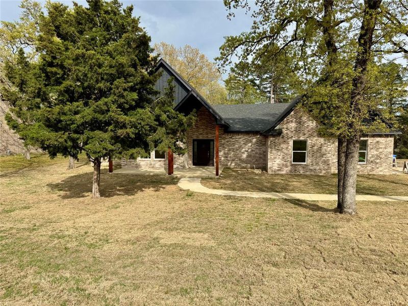 Front exterior of a new home in , Mineola, TX, highlighting curb appeal (Image 1). Front exterior of a new home in , Mineola, TX, highlighting curb appeal (Image 1).