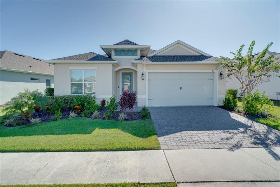 Front exterior of a new home in , Kissimmee, FL, highlighting curb appeal (Image 20).