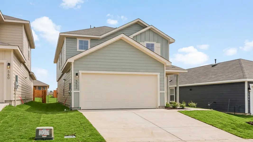 Front exterior of a new home in Prairie Lakes, Buda, TX, highlighting curb appeal (Image 2).