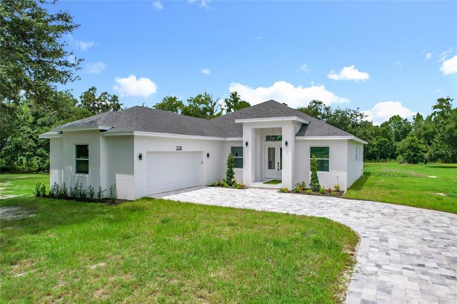 Front exterior of a new home in , Plant City, FL, highlighting curb appeal (Image 1). Front exterior of a new home in , Plant City, FL, highlighting curb appeal (Image 1).