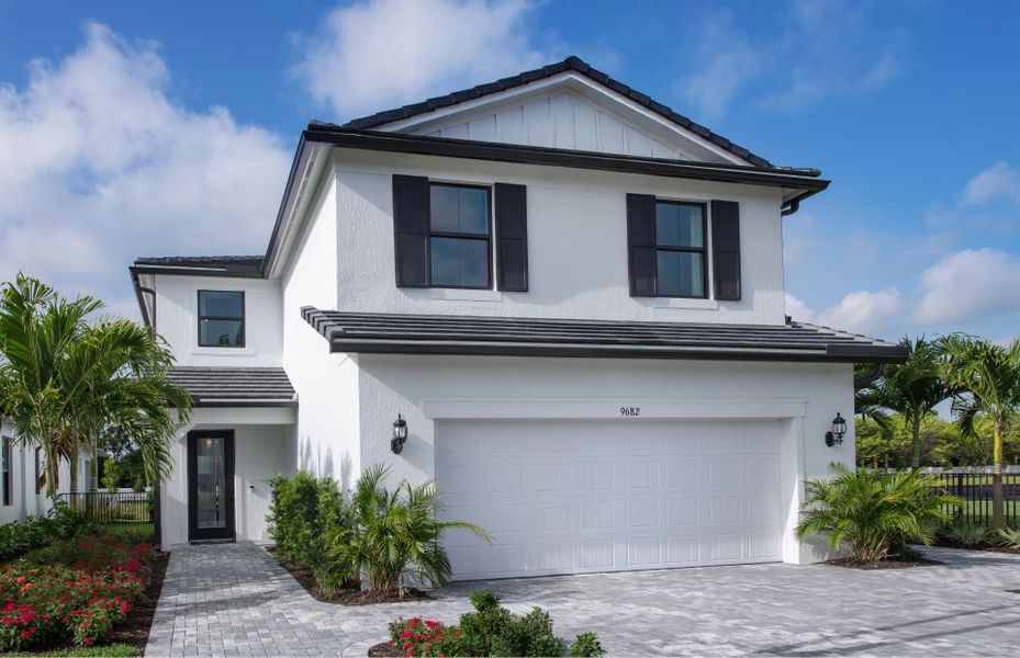 Front exterior of a new home in Hendrix Reserve, Lake Worth, FL, highlighting curb appeal (Image 19).