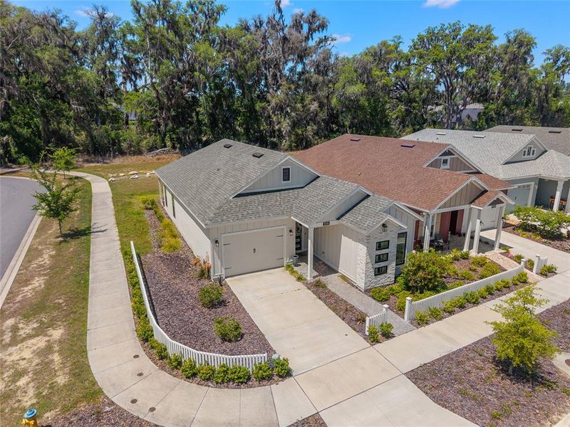 Front exterior of a new home in Fairway Pointe at West End, Newberry, FL, highlighting curb appeal (Image 27).