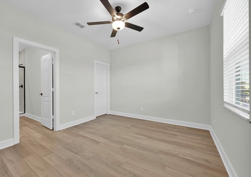 Rest and relaxation await in the master bedroom