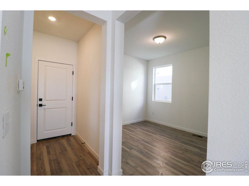 Main floor office, door to the two car garage