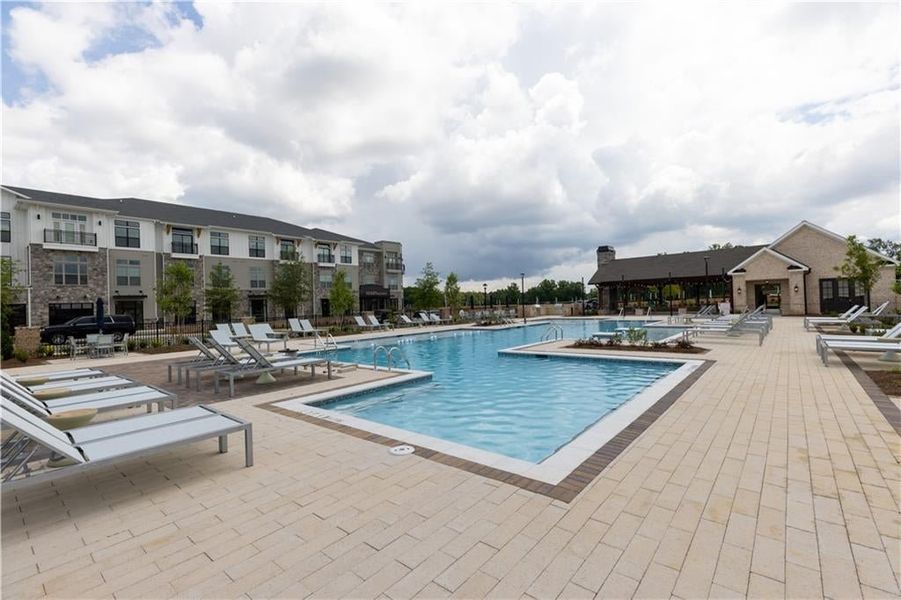 Community pool featuring a patio
