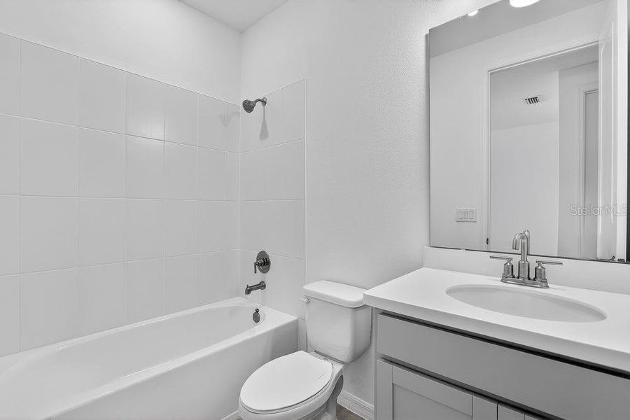 Furnished interior view inside a new home in Ardisia Park, New Smyrna Beach (Image 17).