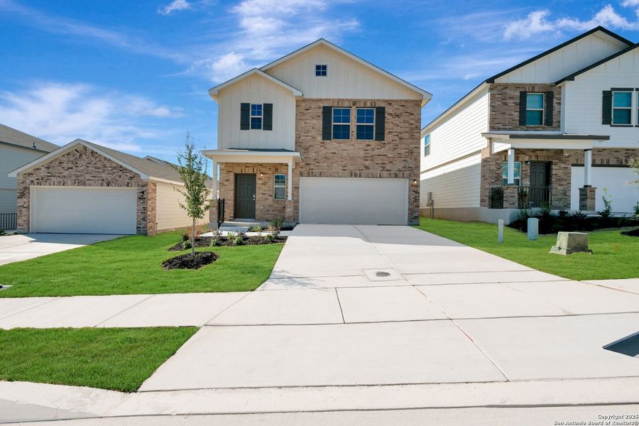 Front exterior of a new home in Paloma Park, Converse, TX, highlighting curb appeal (Image 20).