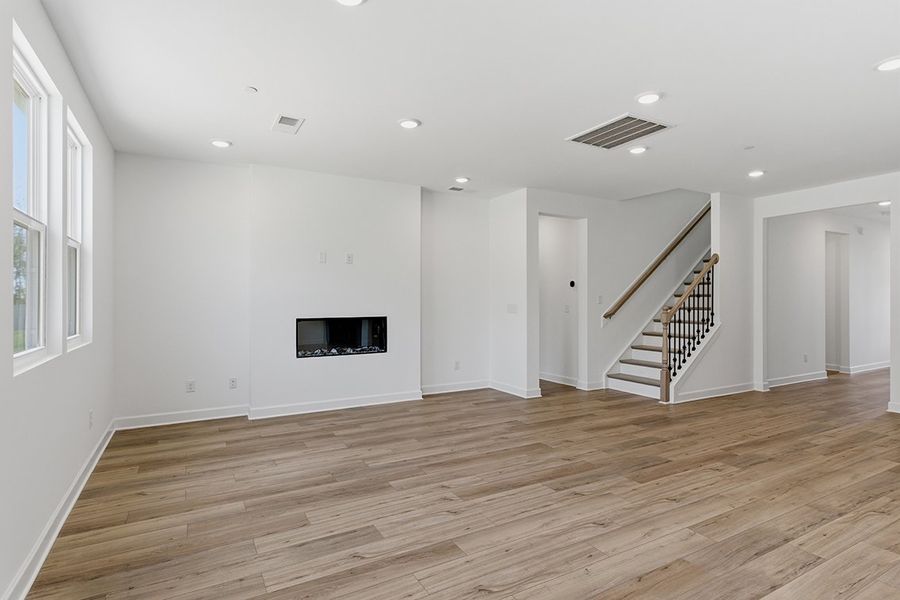 A room with a wood floor and a wood floor. A room with a wood floor and a wood floor.