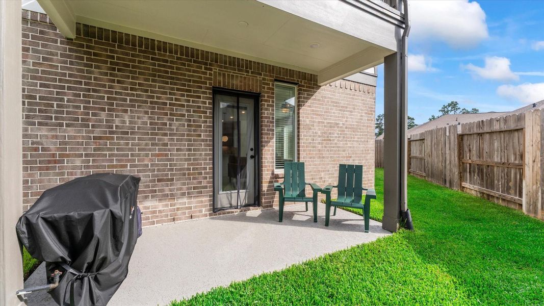 Exterior details and patio area of a home in Balmoral, Humble (Image 26).