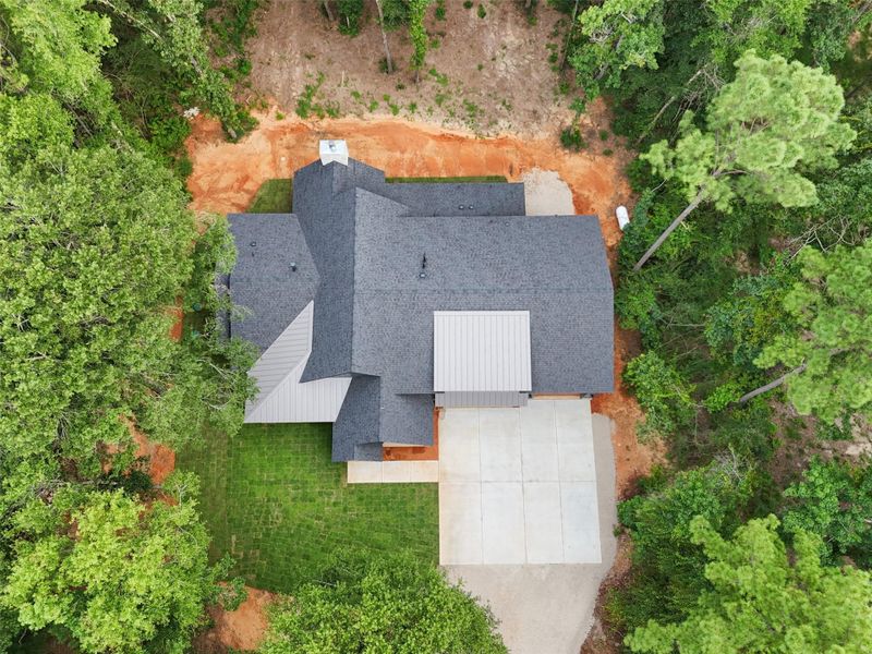 Front exterior of a new home in , Willis, TX, highlighting curb appeal (Image 26).