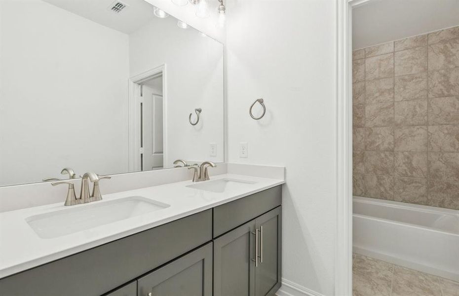 Spacious secondary bathroom with double vanity Spacious secondary bathroom with double vanity