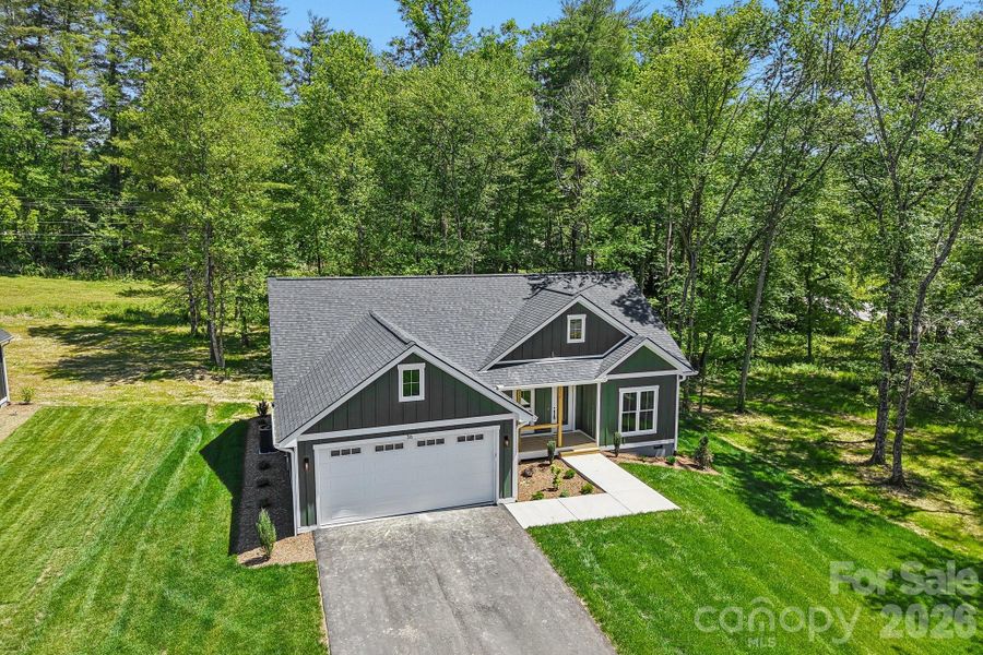 Front exterior of a new home in , Hendersonville, NC, highlighting curb appeal (Image 21).