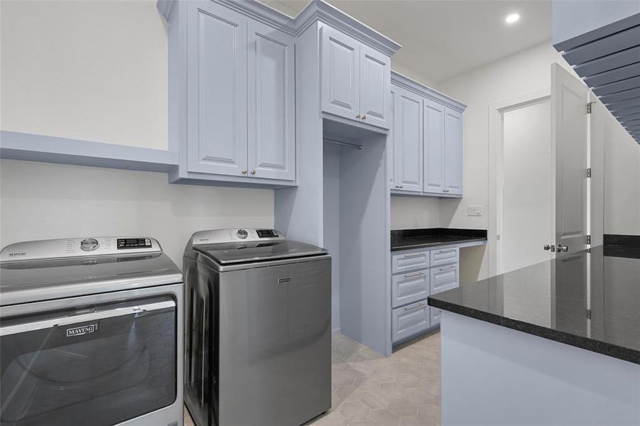 Laundry room with light tile patterned floors, independent washer and dryer, recessed lighting, and cabinet space Laundry room with light tile patterned floors, independent washer and dryer, recessed lighting, and cabinet space