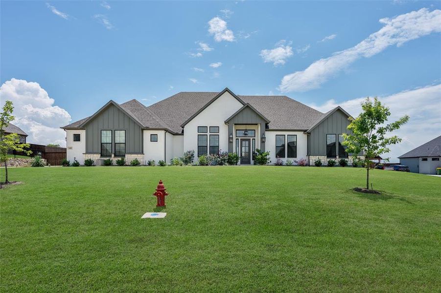 Front exterior of a new home in , Waxahachie, TX, highlighting curb appeal (Image 21). Front exterior of a new home in , Waxahachie, TX, highlighting curb appeal (Image 21).