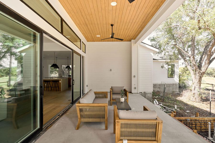 View of patio featuring ceiling fan and an outdoor hangout area View of patio featuring ceiling fan and an outdoor hangout area
