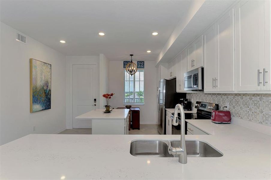 Furnished interior view inside a new home in Wellen Park Golf & Country Club, Venice (Image 30).