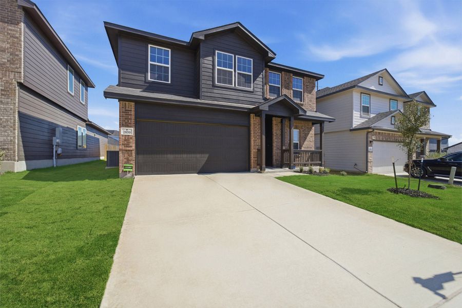 Front exterior of a new home in Laurel Vistas, San Antonio, TX, highlighting curb appeal (Image 28).