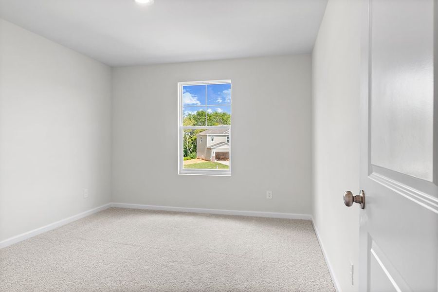 A room with a window and a door.