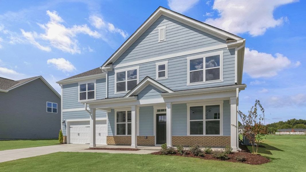 Representative exterior photo of a completed home built from the NORMAN by D.R. Horton in Eagle Creek, Fuquay Varina, NC (Image 18).