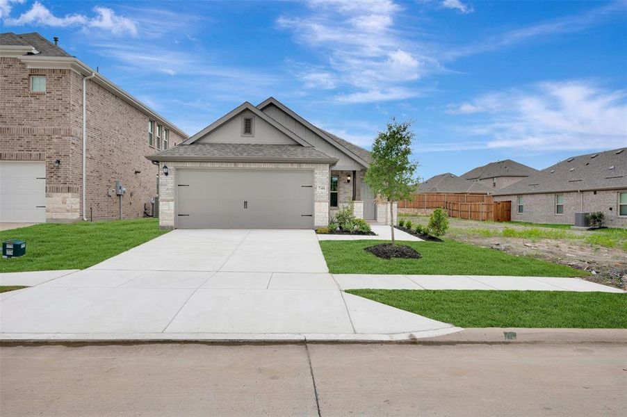 Front exterior of a new home in Elevon, Lavon, TX, highlighting curb appeal (Image 2). Front exterior of a new home in Elevon, Lavon, TX, highlighting curb appeal (Image 2).