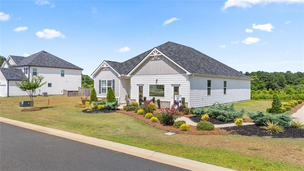 Front exterior of a new home in The Preserve at Agricultural Village, Perry, GA, highlighting curb appeal (Image 2). Front exterior of a new home in The Preserve at Agricultural Village, Perry, GA, highlighting curb appeal (Image 2).
