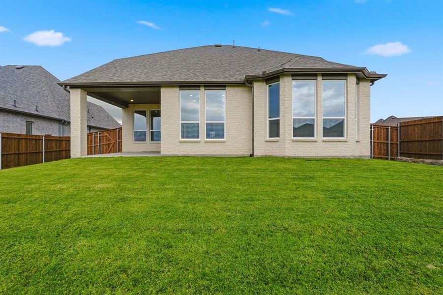 Exterior details and patio area of a home in Devonshire, Forney (Image 18).