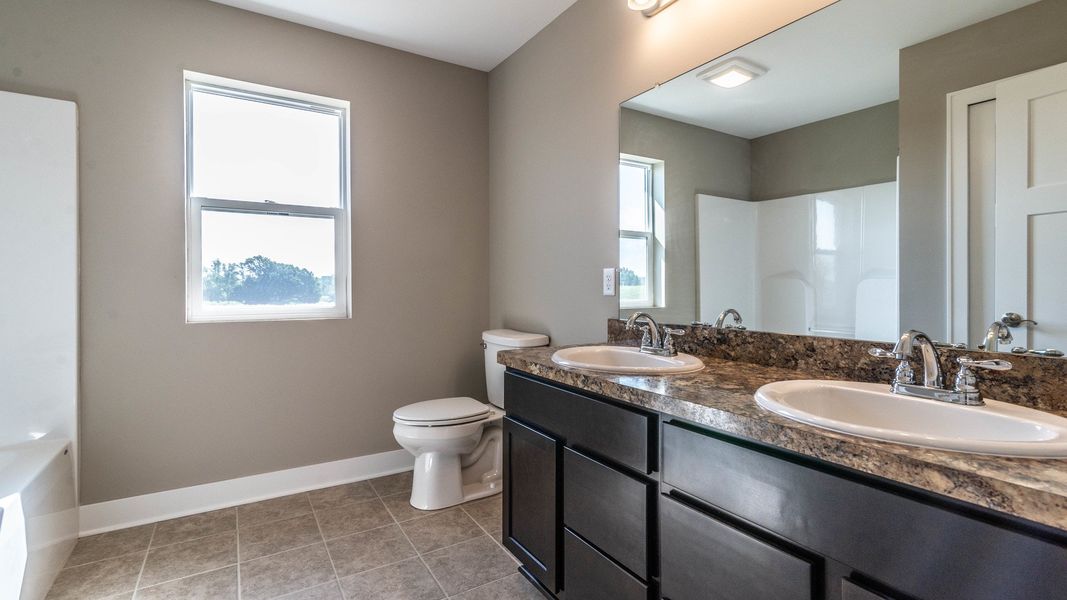 Representative furnished interior of a home built from the The Winslow by Norfolk Homes in Valleys, Jackson (Image 38).