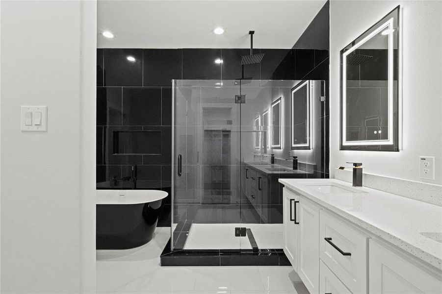 Bathroom featuring vanity and plus walk in shower