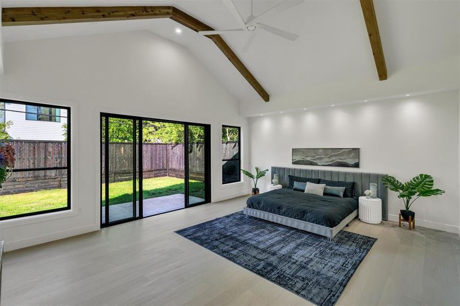 Bedroom featuring high vaulted ceiling, ceiling fan, beamed ceiling, light hardwood / wood-style floors, and access to exterior