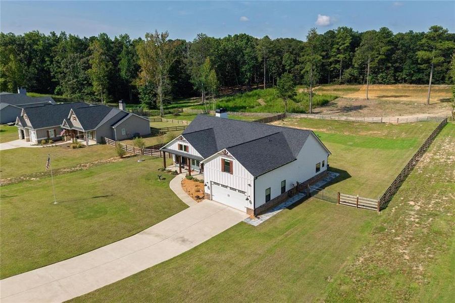 Front exterior of a new home in , Dallas, GA, highlighting curb appeal (Image 24).