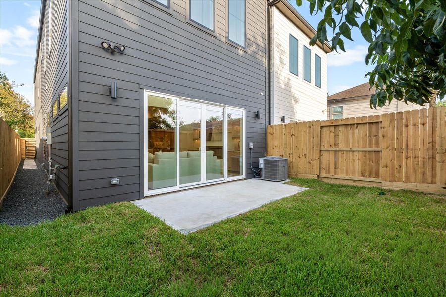 Large private backyard with patio is fully fenced in. Drainage system is tied into the gutter downspouts. Large private backyard with patio is fully fenced in. Drainage system is tied into the gutter downspouts.