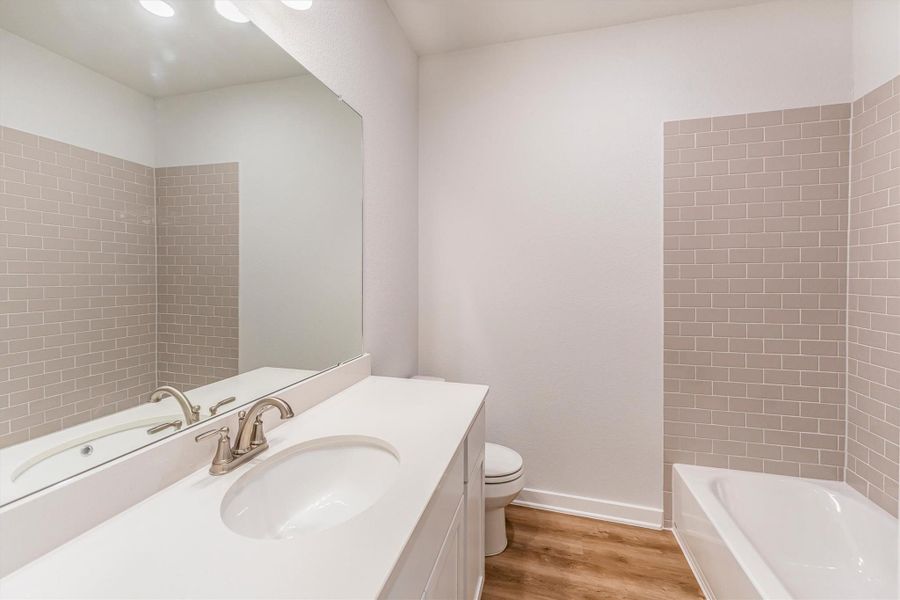 Furnished interior view inside a new home in Deer Pines, Conroe (Image 14).