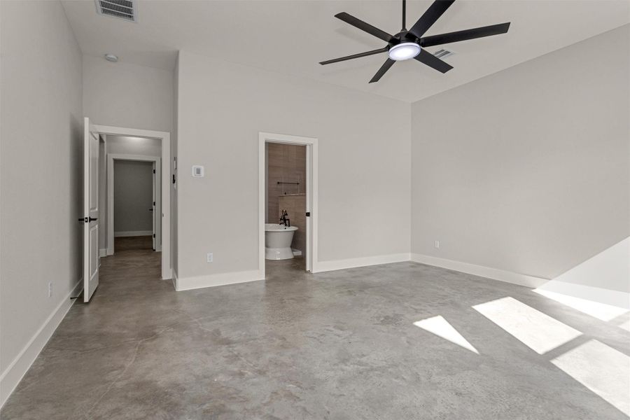 The spacious primary bedroom offers a peaceful retreat with plenty of room to relax and unwind. Large windows frame serene views of the backyard, allowing natural light to pour in while creating a calm, airy atmosphere.Designed for comfort and privacy, the suite seamlessly connects to a well-appointed en suite bath, providing a private sanctuary to start and end your day. This inviting space perfectly balances size, light, and functionality for everyday living.