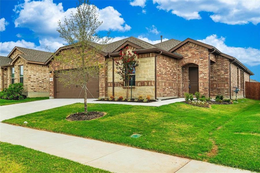 Front exterior of a new home in , Haslet, TX, highlighting curb appeal (Image 2). Front exterior of a new home in , Haslet, TX, highlighting curb appeal (Image 2).